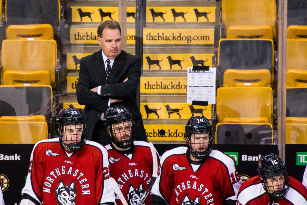 Northeastern head coach Jim Madigan stands behind the bench in 2017 at TD Garden, where he hopes NU students will turn out in droves for the 2019 Beanpot. 