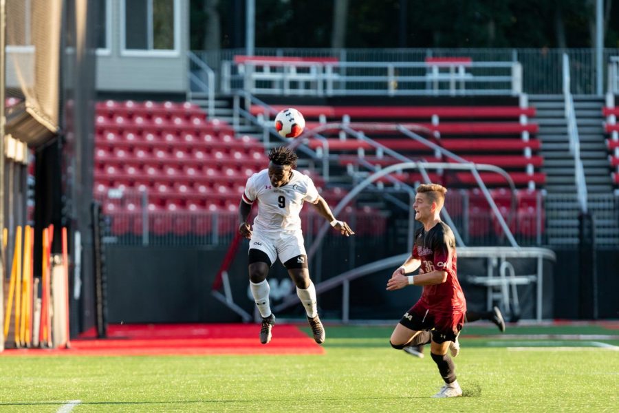 Redshirt freshman forward and CAA Rookie of the Year Timothy Ennin goes for a header in a game against Charleston earlier this season.