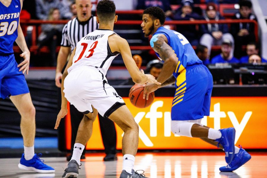 Junior guard Myles Franklin prepares to duck a screen in a postseason matchup vs Hofstra last season. 