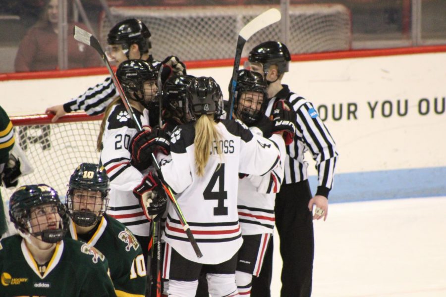 The NU skaters celebrate their second of three goals. 