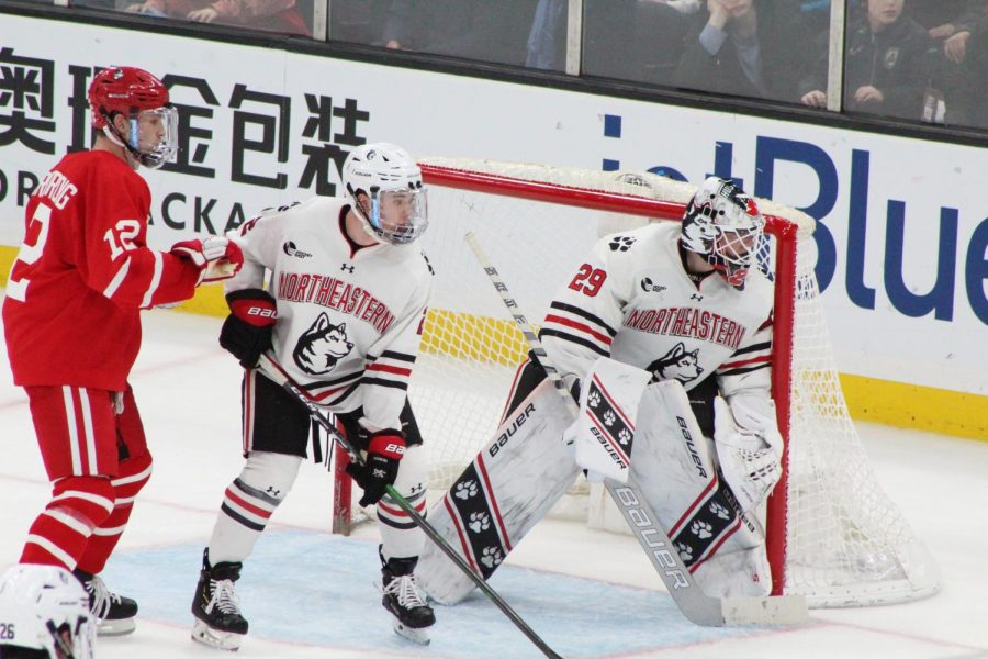 Craig Pantano peers behind the net during the Beanpot final earlier this week. 