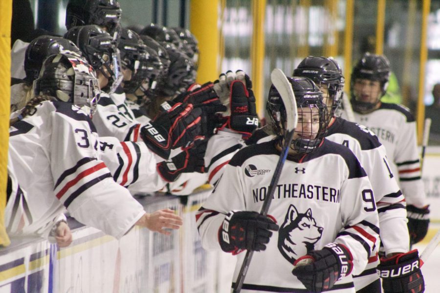 Peyton Anderson and the NU Huskies celebrate their ninth goal of the contest.