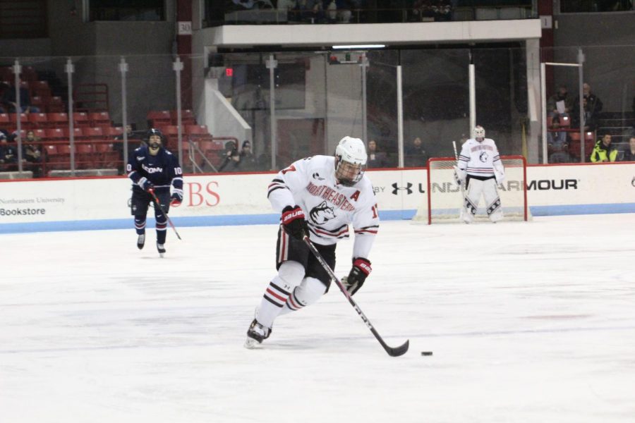 Matt Filipe skates the puck to the opposing net in a game against UConn last season in January.