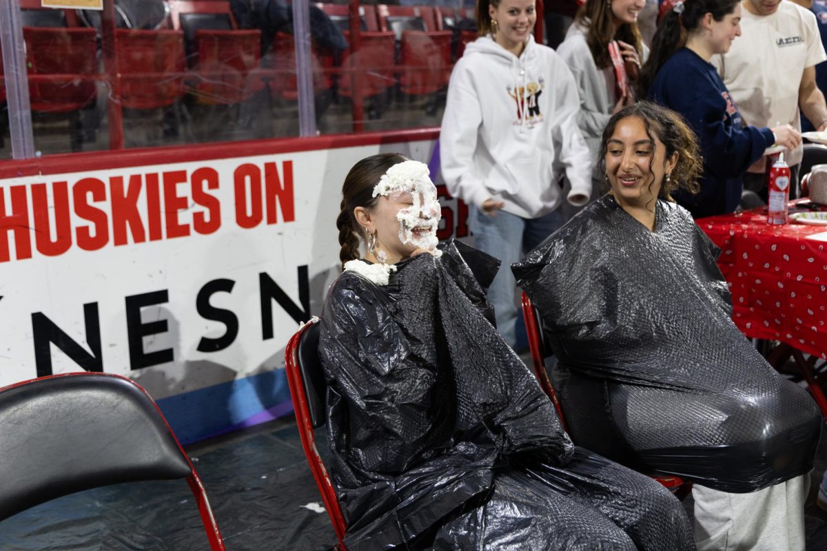 A student smiles after getting pied in the face during Northeastern's Relay for Life fundraiser March 22. Read more here.