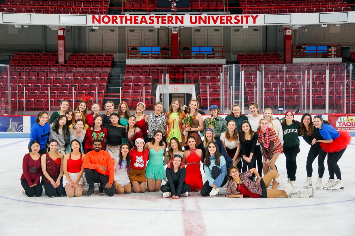 The Northeastern Club Figure Skating team poses for a group photo after their Holiday Show Dec. 4. The team was riding high after finishing sixth place out of 24 teams at the Nov. 10 Violet Ice Classic, gathering a team record of 186 total points. Photo courtesy Sydney Ciardi, Red and Black.
