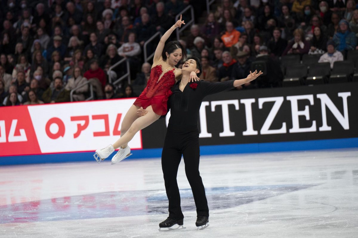 Ryuichi Kihara lifts his partner Riku Miura into the air while moving across the ice during the pairs free skate March 27. The Japanese duo’s free skate and short program featured nearly perfect synchronization and difficult throw jumps, which led them to take home the gold.