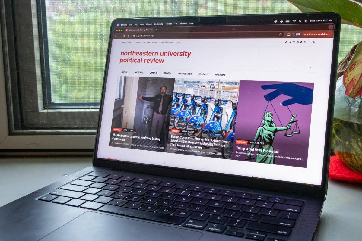 A laptop displaying the Northeastern University Political Review's main page. The review prioritized the safety of their writers amid mass visa cancellations.