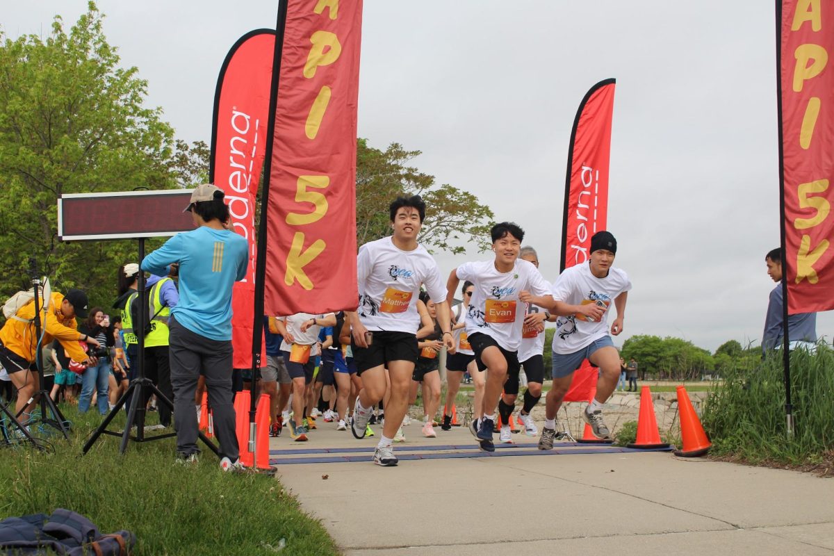 Three runners representing the Asian Pacific American Advocates New England chapter, or OCA APAA NE, a non-profit organization that empowers young generations of AAPI leaders, start the race. The race started promptly at 8:30 a.m. and was divided into four flights that took off two minutes apart. 